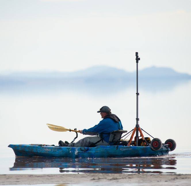 Brian Footen paddles his kayak equipped with 360-degree photographic equipment