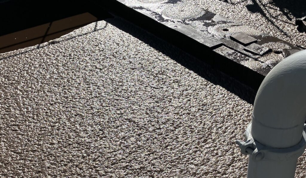 Wastewater surface showing active bubbling from biological nutrient removal process.